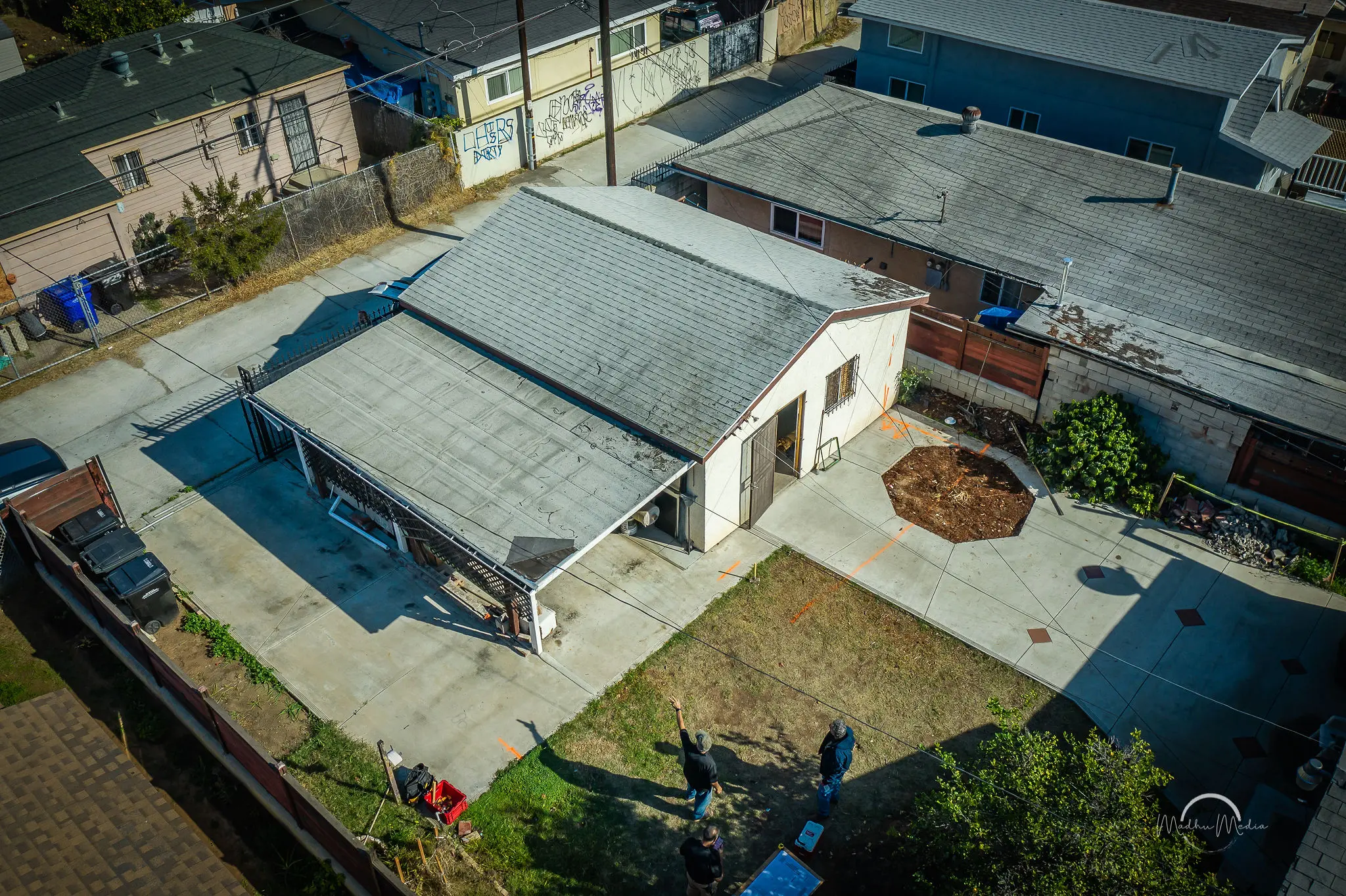 Aerial view of suburban house and yard.