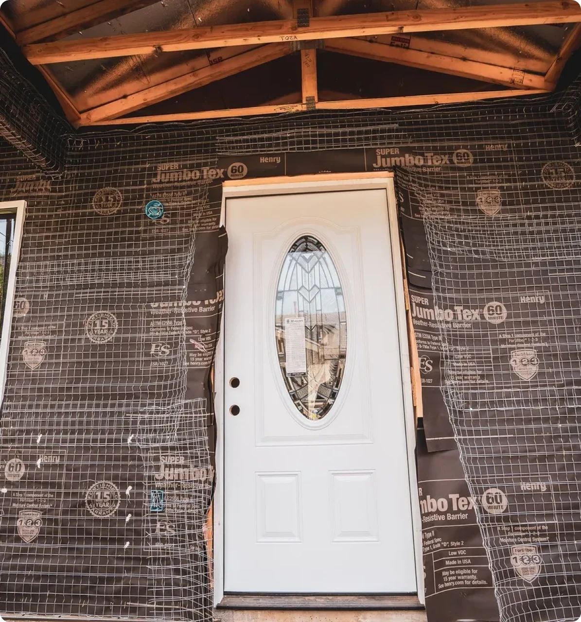 White door with construction material surrounding it.
